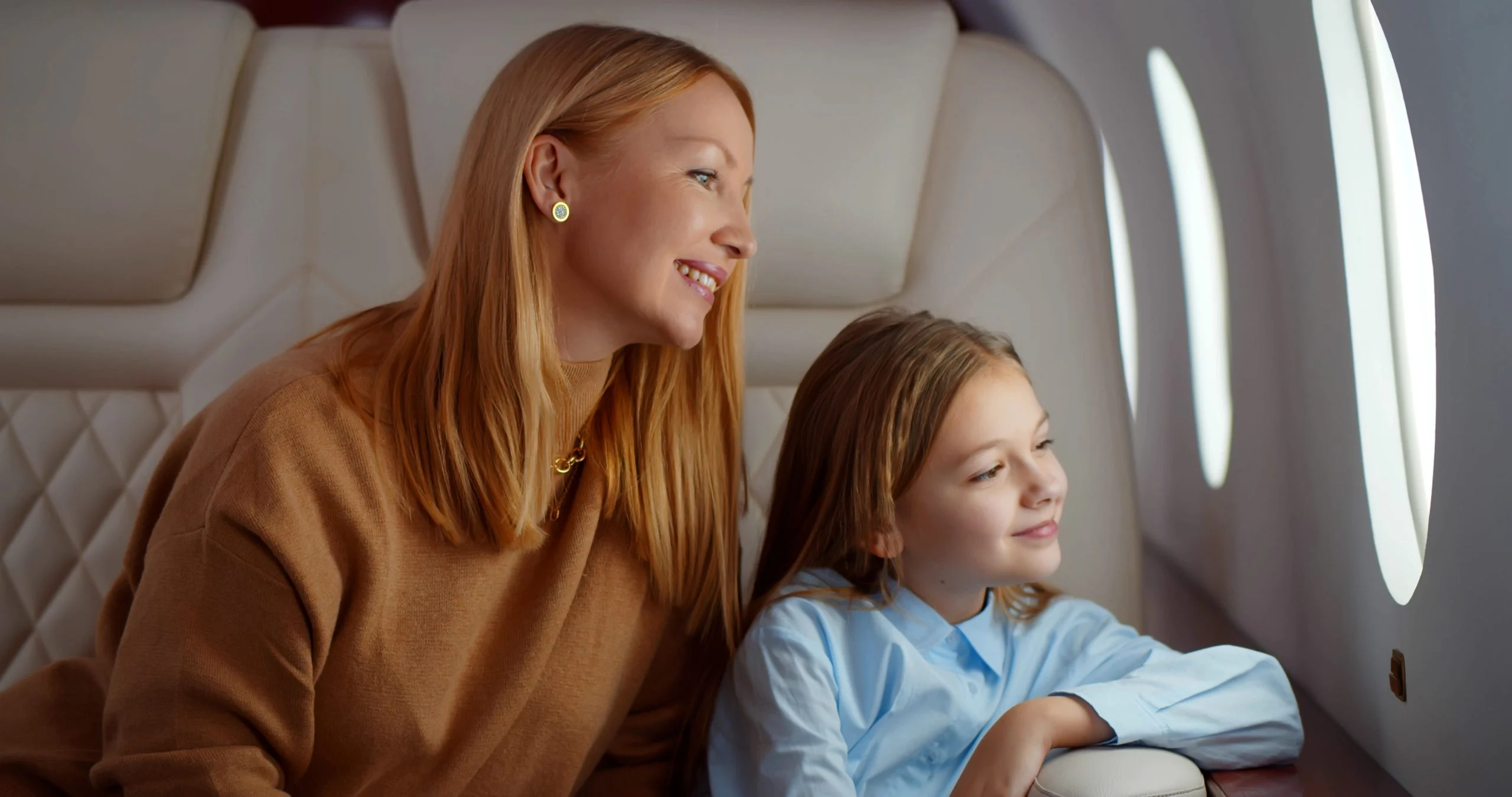 soulbird mother daughter private jet window scaled